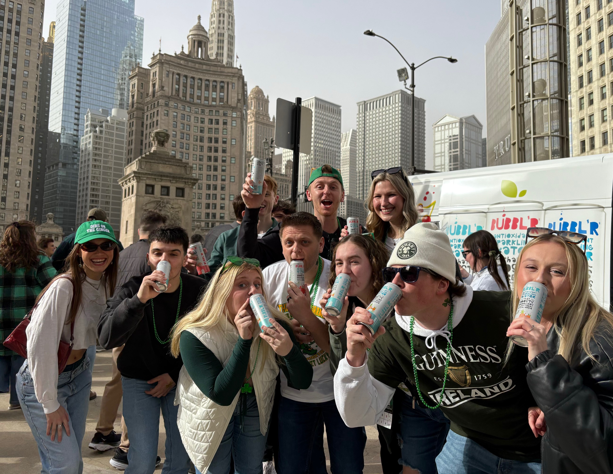 Crowd drinking BUBBL'R beside a branded truck in downtown Chicago